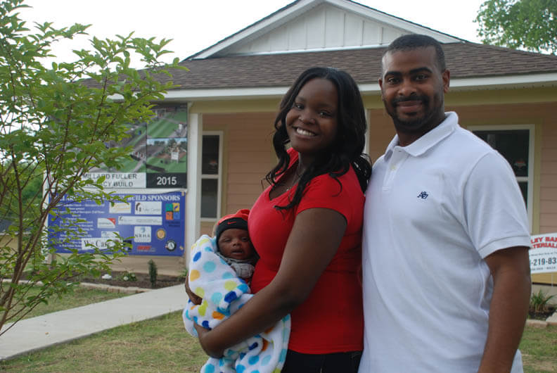 People in front of a house