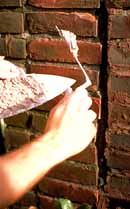 This mortar is the proper consistency for repointing historic brick. Photo: John P. Speweik.