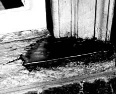 This illustrates a two-part expoxy patching compound used to fill the surface of a weathered sill and rebuild the missing edge. When the epoxy cures, it can be sanded smooth and painted to achieve a durable and waterproof repair. Photo: NPS Files