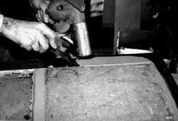 Sash can be removed and repaired in a convenient work area. Paint is being removed from this sash with a hot air gun.